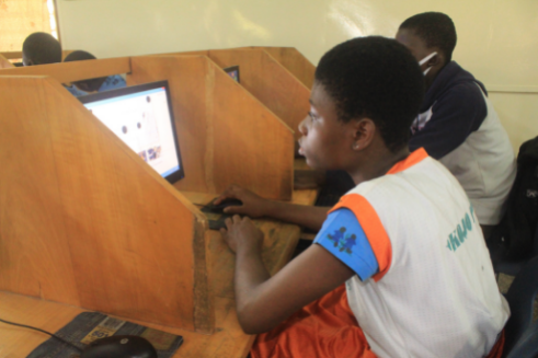 Child in SOS Children's Village School, working on computer